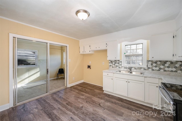 kitchen featuring backsplash, white cabinets, sink, electric range, and dark hardwood / wood-style flooring