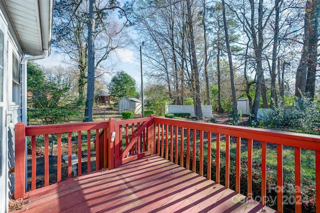 wooden terrace with a shed