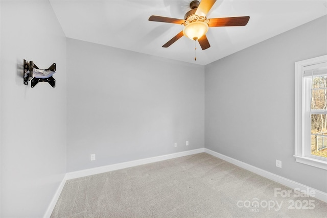 unfurnished room featuring carpet flooring, plenty of natural light, and ceiling fan