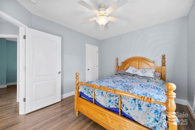 bedroom with hardwood / wood-style flooring and ceiling fan