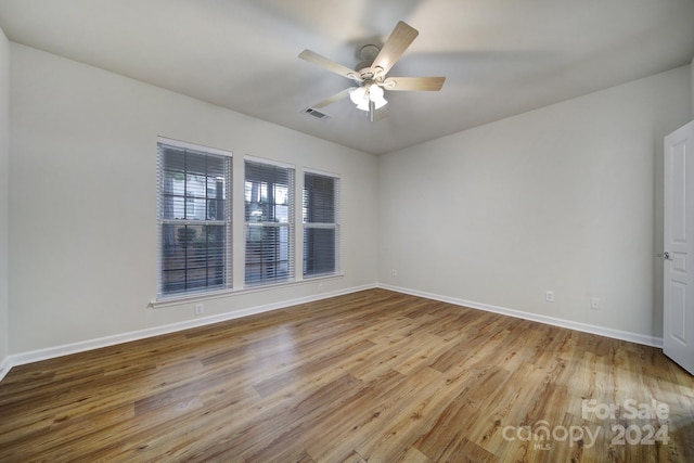 spare room with light hardwood / wood-style floors and ceiling fan