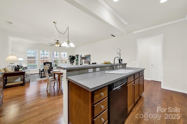 kitchen with visible vents, dark wood-type flooring, open floor plan, black dishwasher, and a sink