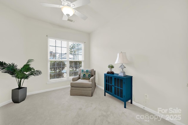 sitting room featuring visible vents, baseboards, ceiling fan, and carpet flooring