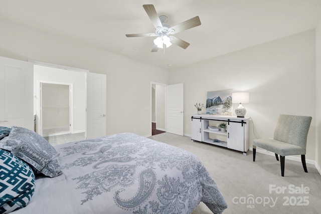 carpeted bedroom with a ceiling fan and baseboards