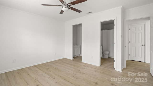 unfurnished bedroom with visible vents, baseboards, ensuite bath, ornamental molding, and light wood-type flooring