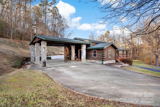 view of side of home with a carport