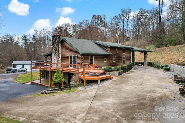 view of home's exterior featuring a deck