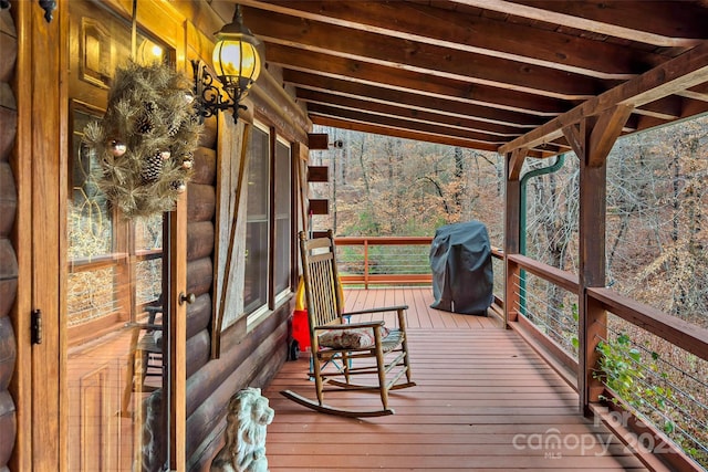 deck featuring area for grilling and covered porch