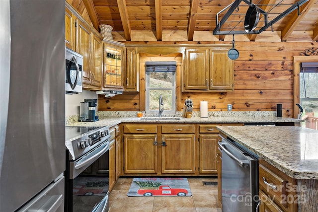 kitchen featuring sink, beamed ceiling, wood ceiling, and appliances with stainless steel finishes