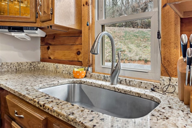 interior details with light stone counters and sink