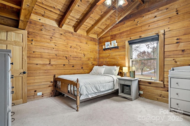 carpeted bedroom with beam ceiling, ceiling fan, wooden walls, and wood ceiling