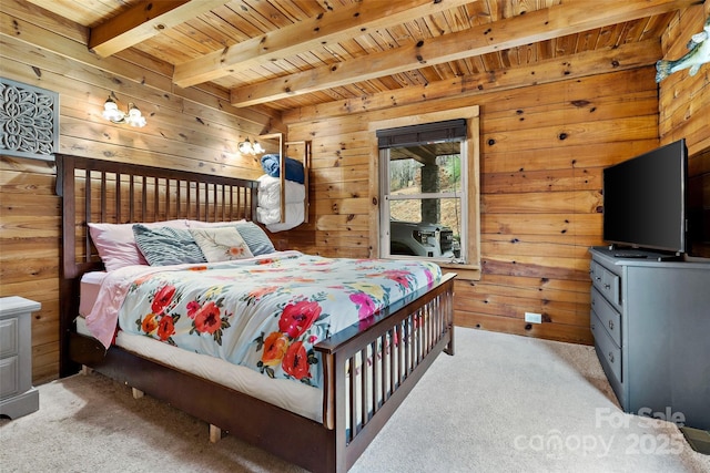 bedroom with wooden ceiling, beamed ceiling, light colored carpet, and wood walls