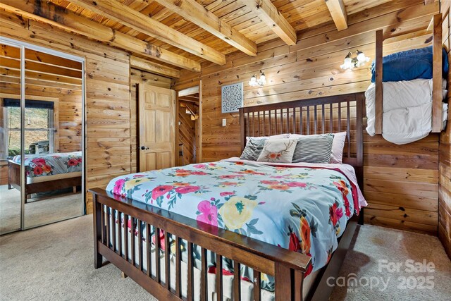 bedroom featuring carpet, wooden walls, beamed ceiling, and wood ceiling