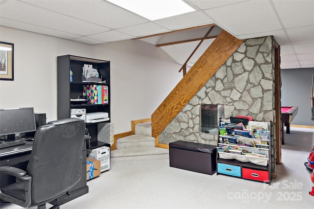 office area with a paneled ceiling