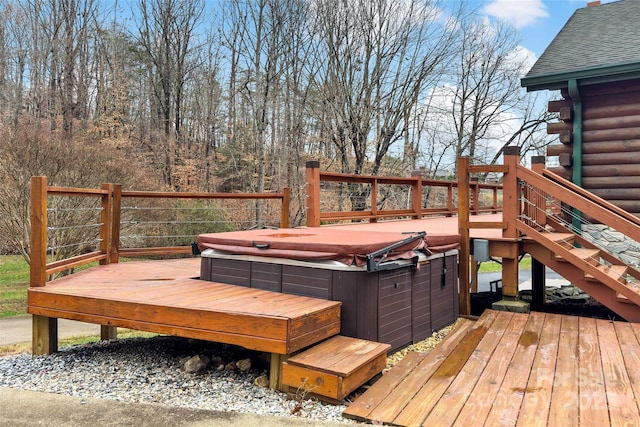 wooden deck featuring a hot tub