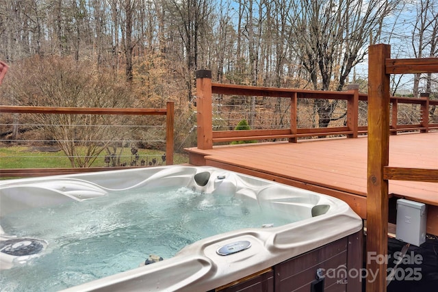 deck featuring a hot tub