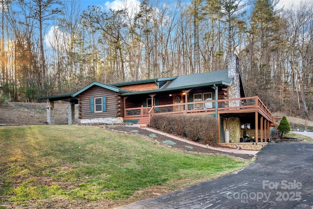 log-style house with a front yard