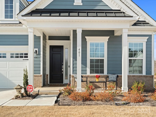 doorway to property with covered porch