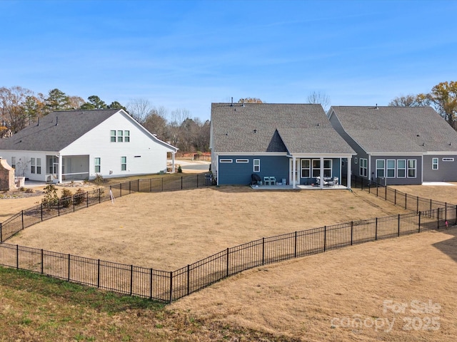 rear view of property with a patio, a yard, and fence private yard