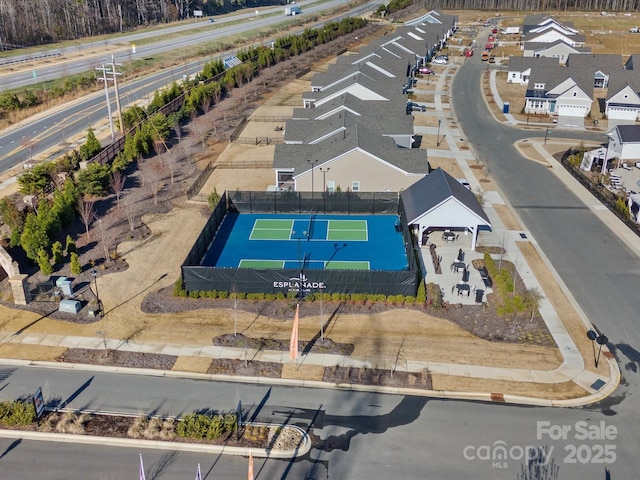 birds eye view of property with a residential view