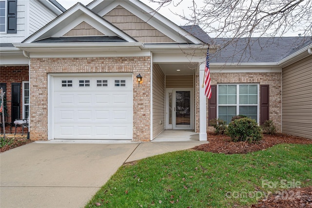 doorway to property featuring a garage