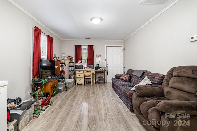 living room featuring hardwood / wood-style floors and crown molding