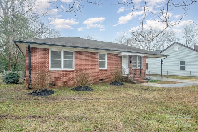 view of front of house with brick siding, crawl space, a shingled roof, and a front lawn