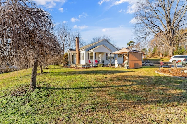 view of front of house with a front lawn and a porch