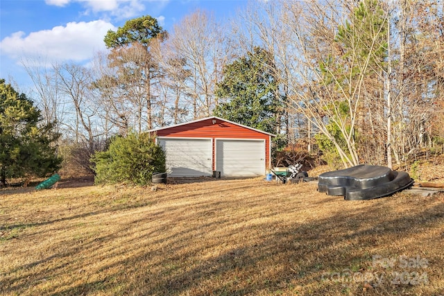 garage with a yard