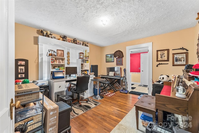 office space featuring a textured ceiling and hardwood / wood-style flooring