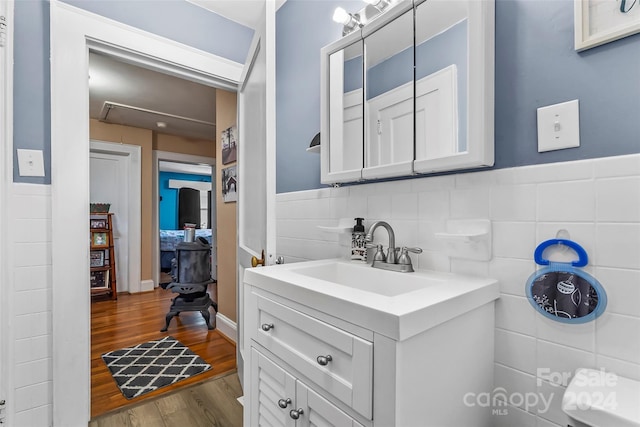 bathroom with vanity and hardwood / wood-style flooring