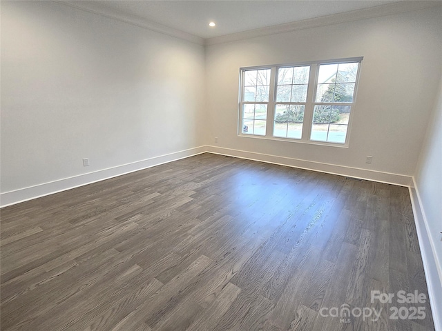 unfurnished room with crown molding and dark hardwood / wood-style flooring