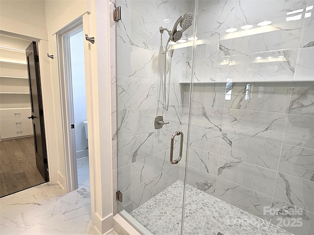 bathroom featuring an enclosed shower