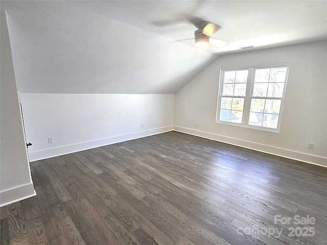 bonus room with lofted ceiling, dark wood-type flooring, and ceiling fan