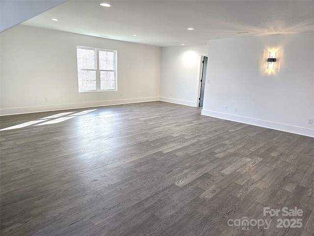 empty room featuring dark hardwood / wood-style flooring