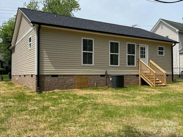 702 Park Ave, Salisbury, NC 28144 - back of property with crawl space, central AC unit, entry steps, a yard, and a shingled roof