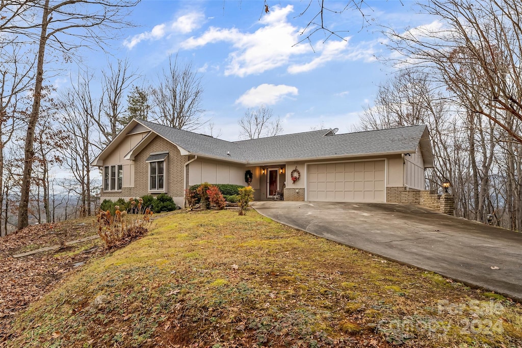 ranch-style home with a garage