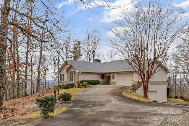 single story home featuring a garage