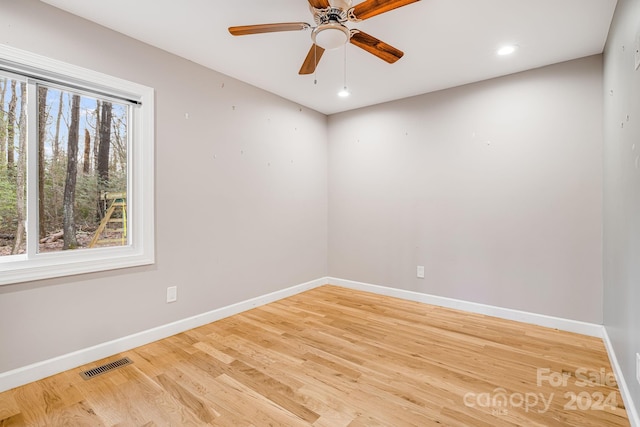 spare room with ceiling fan and light hardwood / wood-style flooring