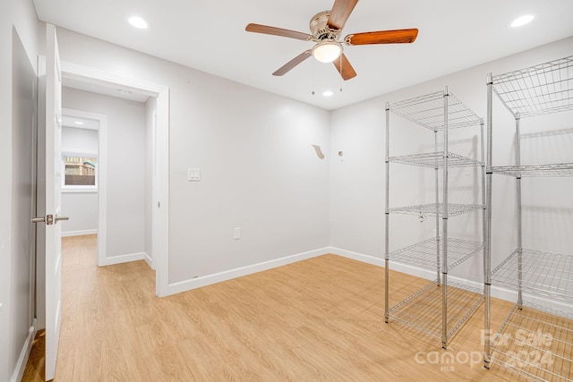 spare room featuring ceiling fan and light wood-type flooring