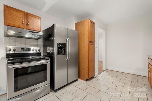 kitchen with stainless steel appliances, tasteful backsplash, and light tile patterned flooring