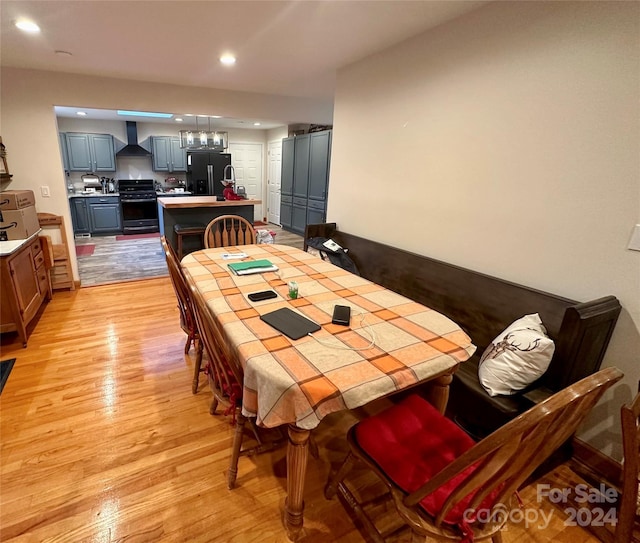 dining area featuring light wood-type flooring