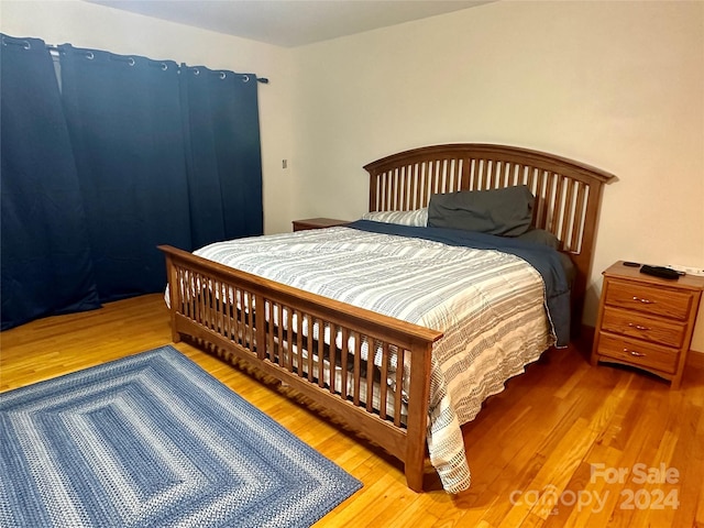 bedroom featuring hardwood / wood-style flooring