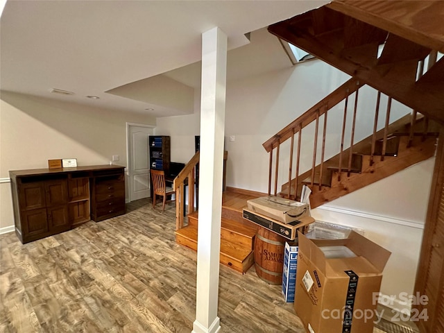 stairs with hardwood / wood-style floors