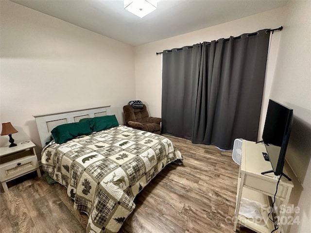 bedroom featuring hardwood / wood-style floors