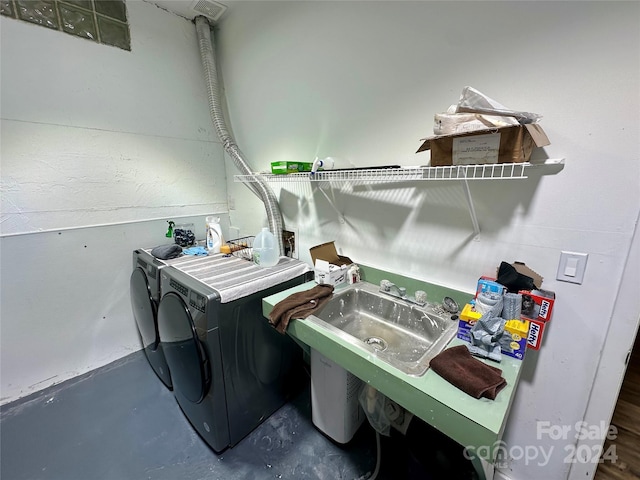 clothes washing area featuring washer and dryer