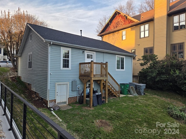 back of house with a yard