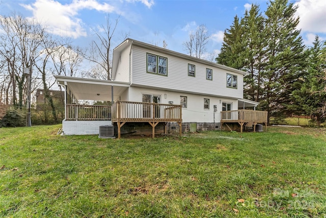 back of house with a lawn, cooling unit, and a deck