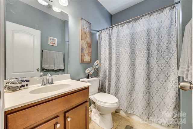 bathroom featuring tile patterned floors, vanity, a shower with shower curtain, and toilet