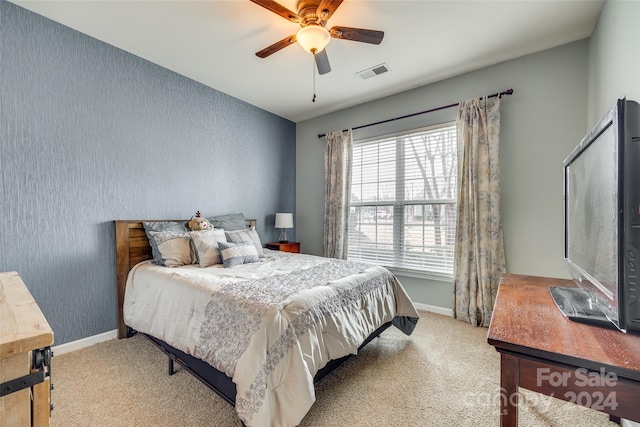 carpeted bedroom featuring ceiling fan